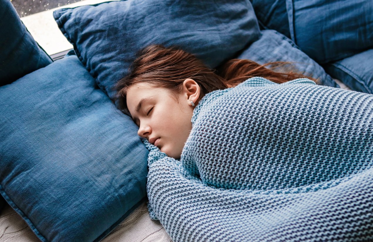 girl sleeping while her ears are hearing