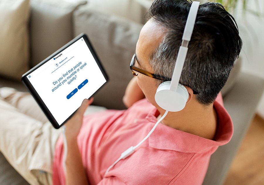 man with headphones and tablet