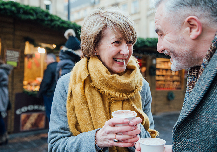 man woman holding coffee