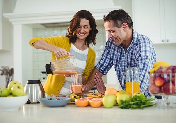 man woman having juice