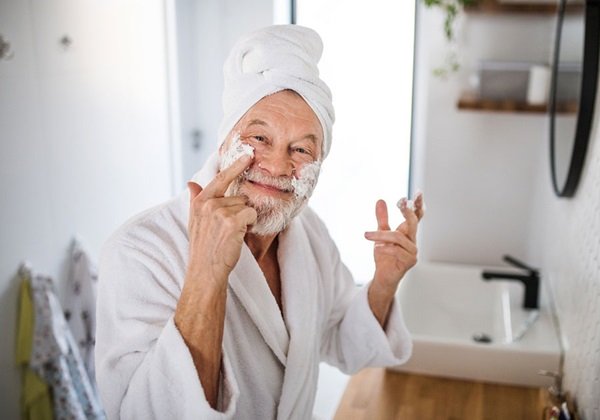 man applying cream