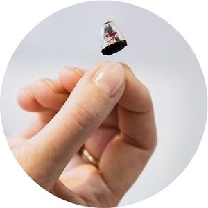 Invisible hearing aid being held