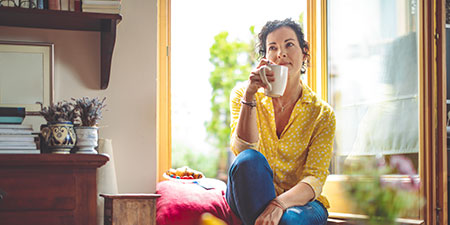 woman at home drinking coffee