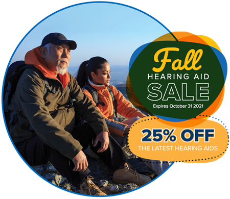 grandfather and granddaughter looking out from a mountain top with graphics of a fall hearing aid sale - 25% off the latest hearing aids