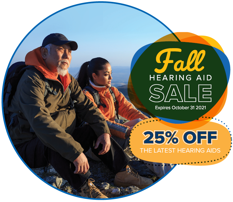 grandfather and granddaughter looking out from a mountain top with graphics of a fall hearing aid sale - 25% off the latest hearing aids
