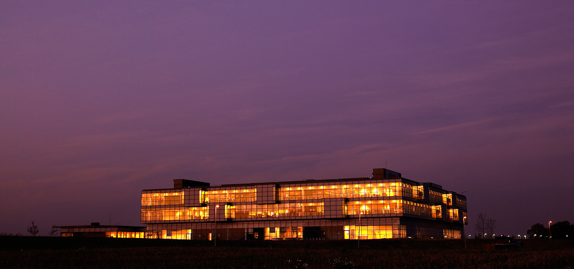Oticon Denmark global headquarters building at night