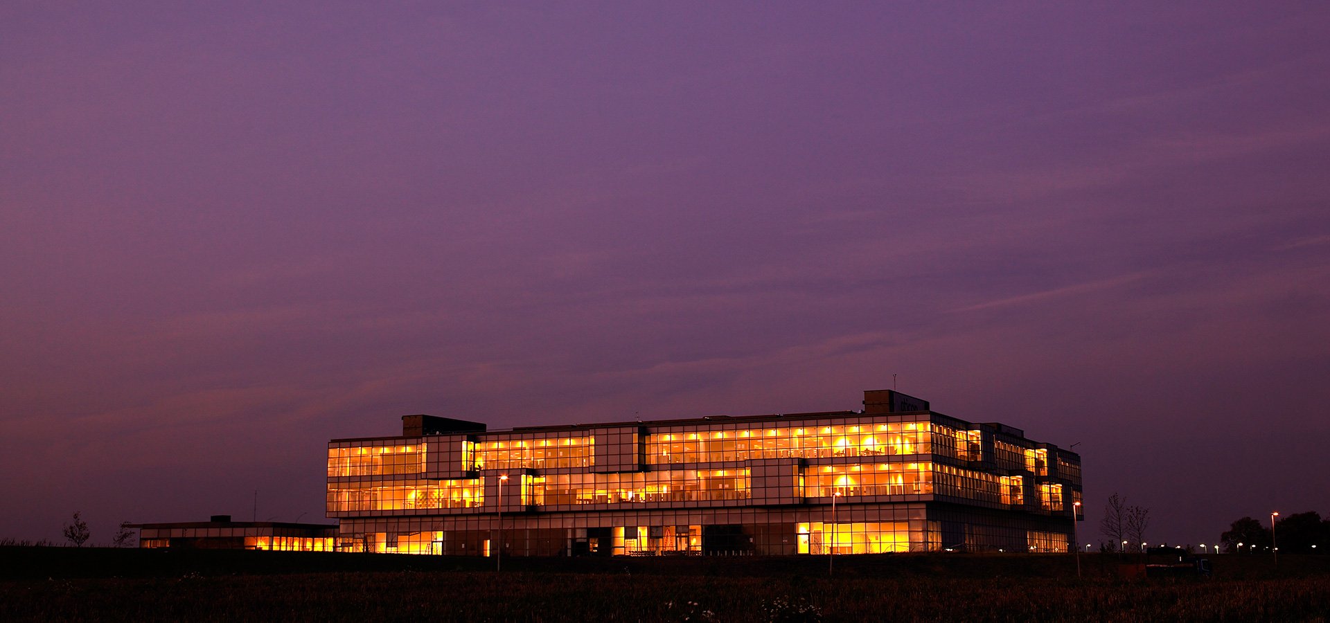 Oticon Denmark global headquarters building at night