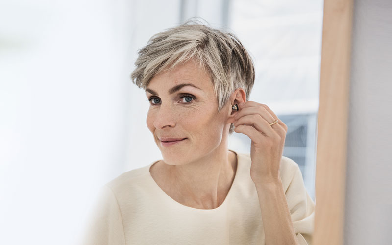 Image result for woman with in the ear hearing aids