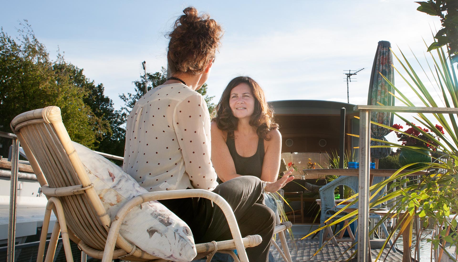 two women talking outside